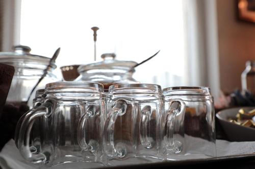 a group of glass jars sitting on a table at Hotel Ristorante Château in Aymavilles