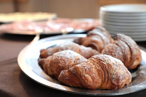 a plate of pastries on top of a table at Hotel Ristorante Château in Aymavilles