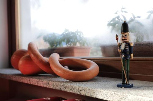 a toy soldier and pretzels on a window sill at Hotel Ristorante Château in Aymavilles