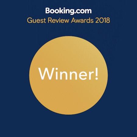 a yellow circle with the words guest review awards on it at Ferienhaus Charme in Grabowhöfe