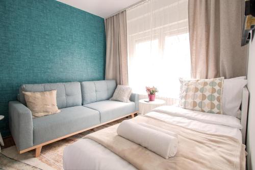 Кровать или кровати в номере Apartment Artorius Ljubljana
