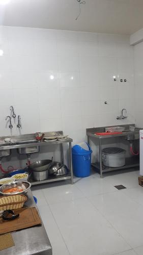 a kitchen with lots of pots and pans at Nayathali Hotel & Lodge Pvt. Ltd in Kawasoti