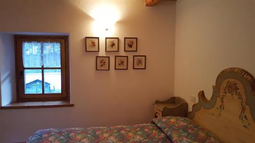 Postel nebo postele na pokoji v ubytování Romantic Loft Sottoguda