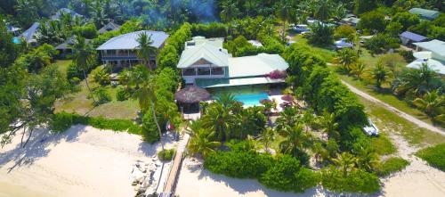 an aerial view of a house on the beach at Villa De Cerf in Cerf Island