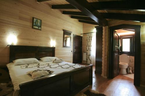 En eller flere senge i et værelse på Complex Turistic Le Baron