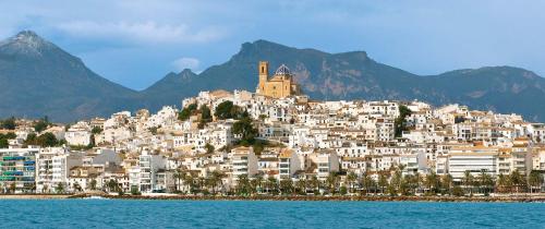 a group of white buildings on top of a mountain at Ashanti Garden Luxury Short Term Rental Duplex Altea in La Nucía