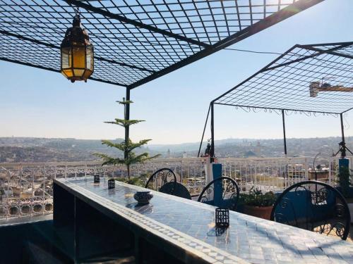 a bar with a view of a city at Palais AL Firdaous in Fès