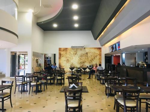 Restoranas ar kita vieta pavalgyti apgyvendinimo įstaigoje Atlas Grand Hotel Virasoro