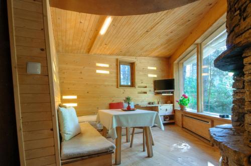a small room with a table in a cabin at Omaya Eco Village in Gaytaninovo