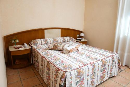 מיטה או מיטות בחדר ב-Hotel Rural Jaumet
