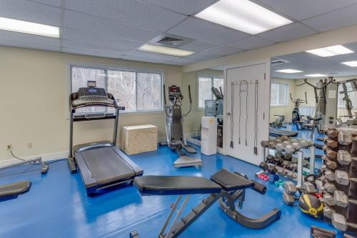 a gym with blue flooring and equipment in a room at Stony Court by Coolvacay in Basye