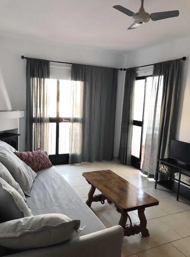a living room with a couch and a coffee table at Capistrano Playa 307 in Nerja