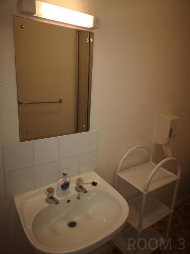 a bathroom with a sink and a mirror at Westgate Hotel in Oxford