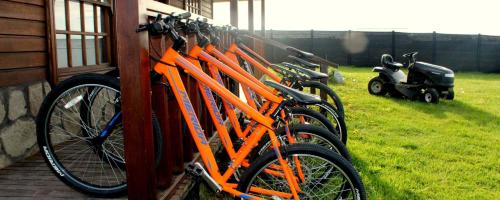 a row of orange bikes parked next to a building at Dorotea Vista in Puerto Natales