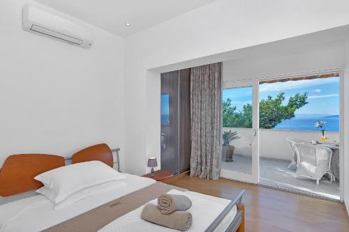 Posteľ alebo postele v izbe v ubytovaní Apartments Rita