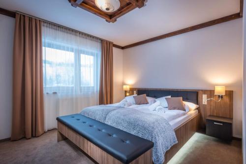 A bed or beds in a room at Apartmany Krasvill