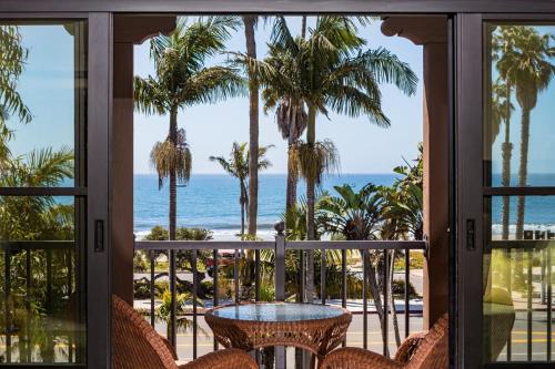 a view of the beach from the balcony of a resort at Santa Barbara Inn in Santa Barbara