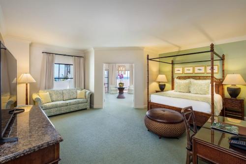 a hotel room with a bed and a couch at Santa Barbara Inn in Santa Barbara