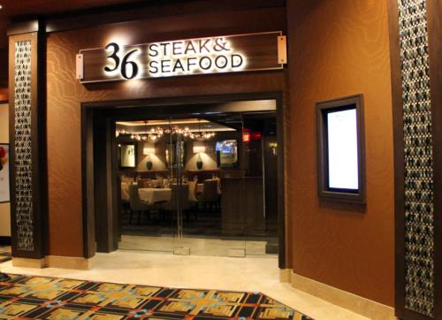 a restaurant entrance with a sign for a steak restaurant at Cactus Petes Resort & Horseshu Hotel in Jackpot