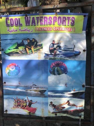 a sign for cool water sports andewater organizations at G Beach Front Villa in Batu Ferringhi