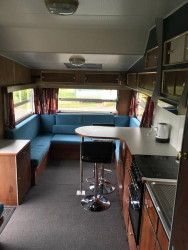 a kitchen and living room in an rv at Riverton Holiday Park in Riverton