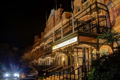 a building with lights on the side of it at night at Norfolk Royale Hotel in Bournemouth