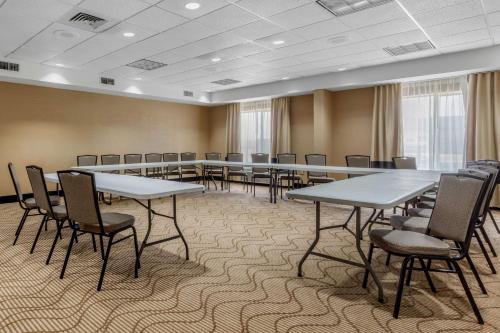 a conference room with tables and chairs in it at Comfort Suites Pelham Hoover I-65 in Pelham