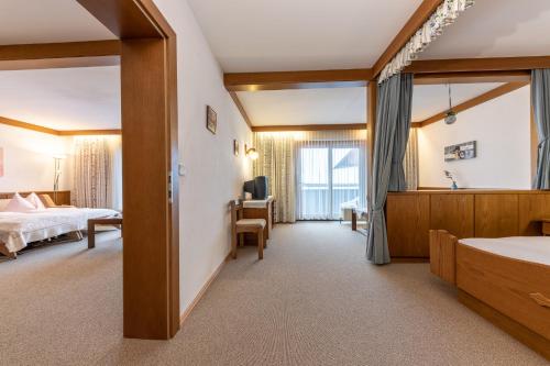 Una cama o camas en una habitación de Frühstückspension-Appartementhaus Wasserer