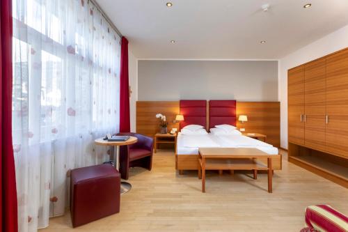Postel nebo postele na pokoji v ubytování Hotel Kolping