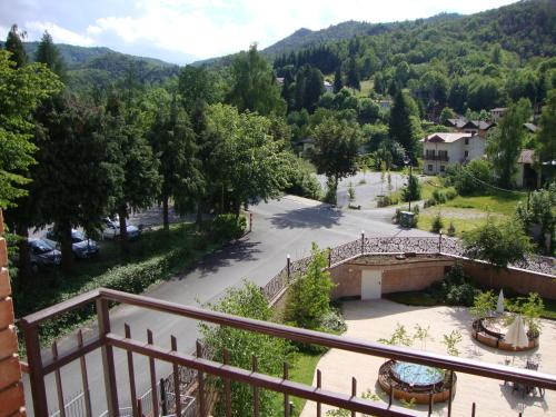 a view from a balcony of a town with a park at Hotel Reale in Lurisia