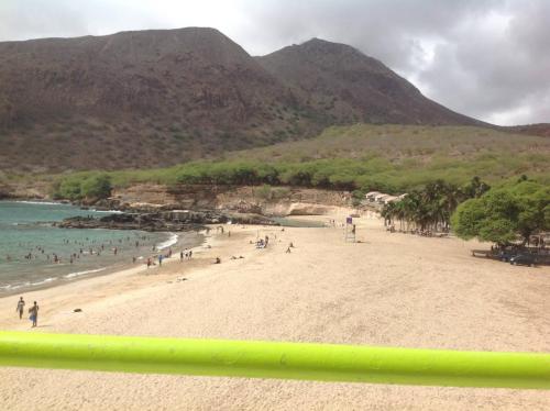 a group of people on a beach near the water at Casa Cabral : Big Apartment next to the beach in Tarrafal