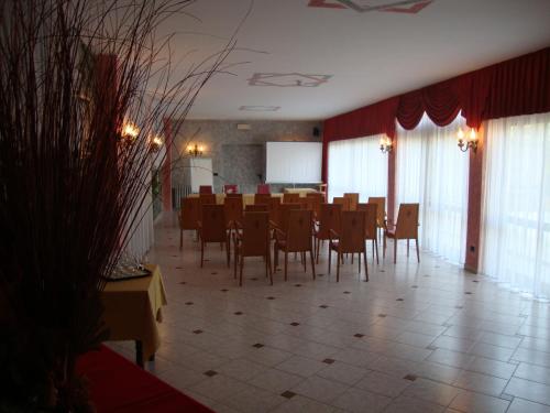 a large room with a table and chairs at Hotel Reale in Lurisia