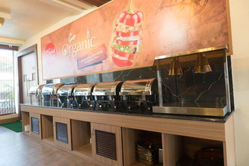 a counter in a restaurant with aasteryasteryasteryasteryasteryasteryasteryasteryastery at Kushal Palli Resorts- A unit of PearlTree Hotels & Resorts in Purulia