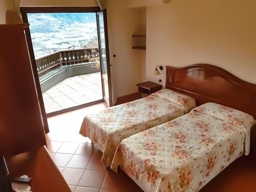 Postelja oz. postelje v sobi nastanitve Hotel Panoramique