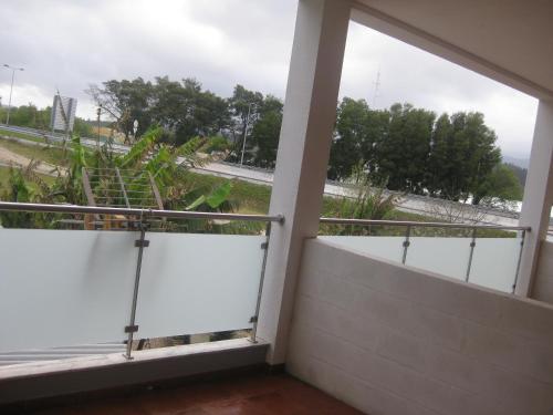 a balcony with a view of a street at Hotel Minho Belo in Vila Nova de Cerveira