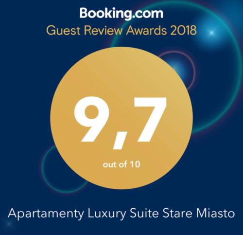 a yellow circle with the text quest review awards at Moon River Apartments Gdansk Old Town in Gdańsk