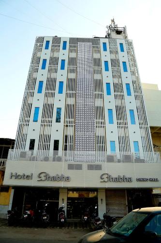 a large building with a hotel chicago at Hotel Bhabha in Rajkot