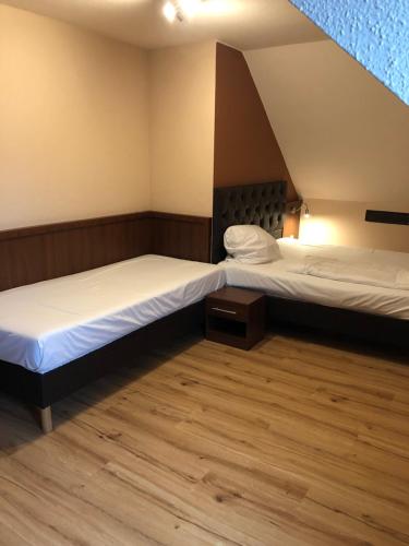 Postel nebo postele na pokoji v ubytování Hotel Poseidon