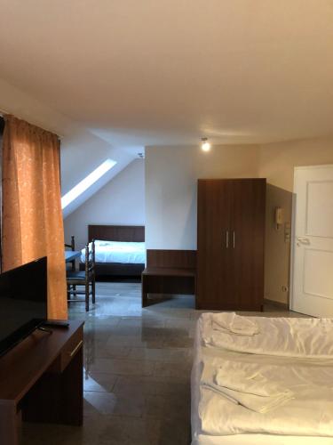 Postel nebo postele na pokoji v ubytování Hotel Poseidon