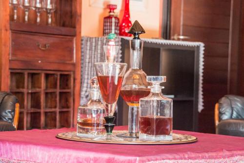 a tray with two glasses of wine on a table at 4-seasons pool villa near Meteora in Tríkala