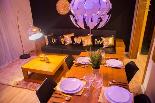 a living room with a table and a couch at Nandy's home in Odza II