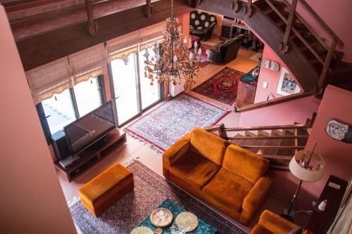 an overhead view of a living room with a couch at 4-seasons pool villa near Meteora in Tríkala