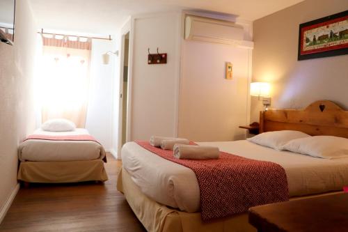 Cama o camas de una habitación en The Originals Annemasse Sud - Porte de Genève