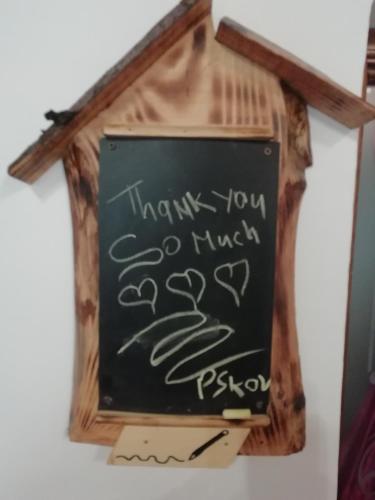 a chalkboard with a sign that says thank you so much at La Casina in Stia
