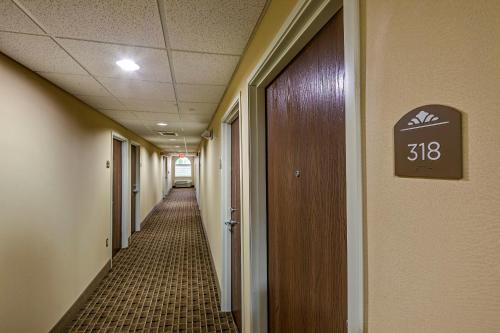 a hallway of an office with a sign on the wall at Microtel Inn and Suites North Canton in North Canton