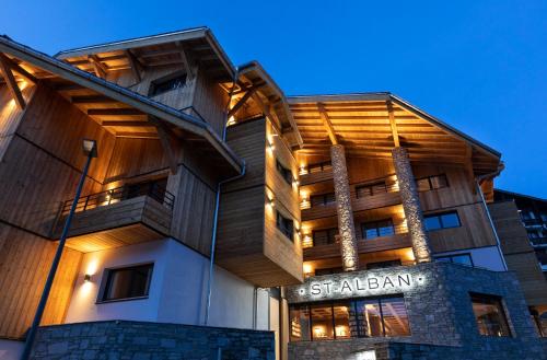 a building with a sign that reads stalkeran at St-Alban Hotel & Spa in La Clusaz