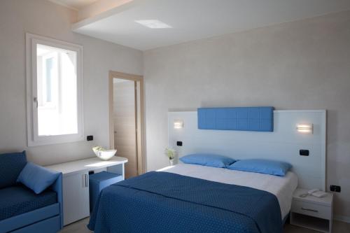 Postel nebo postele na pokoji v ubytování Hotel Rio Bellaria