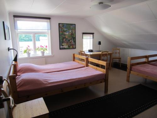 Postel nebo postele na pokoji v ubytování Håverud Hostel