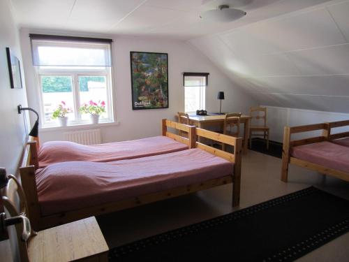 Säng eller sängar i ett rum på Håverud Hostel