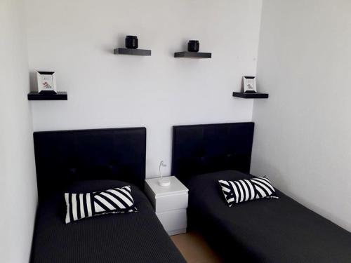 Voodi või voodid majutusasutuse Las Terrazas de La Torre Golf Resort 55 toas